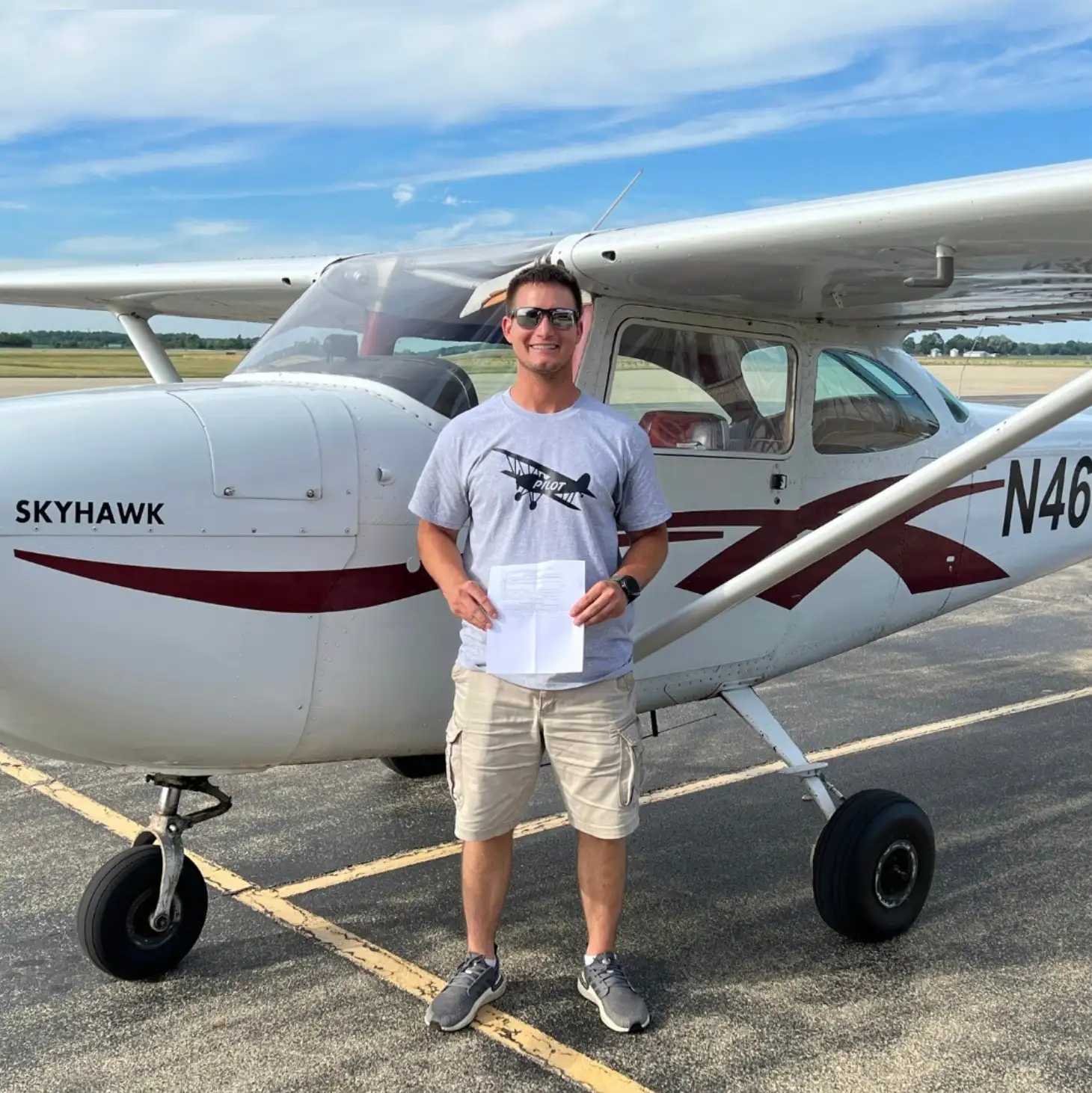 Elite Flight Training commercial pilot student receiving their certificate