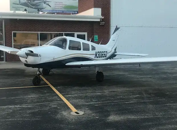 Elite Flight Training Piper Warrior parked at the airport by our flight school