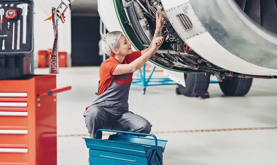 Elite Flight Training & Aircraft Management maintenance technician working on an airplane